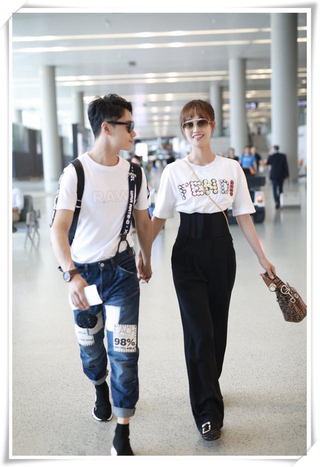 蓝盈莹和曹俊机场秀恩爱,红配黑情侣装太耀眼,女方比男方还要高